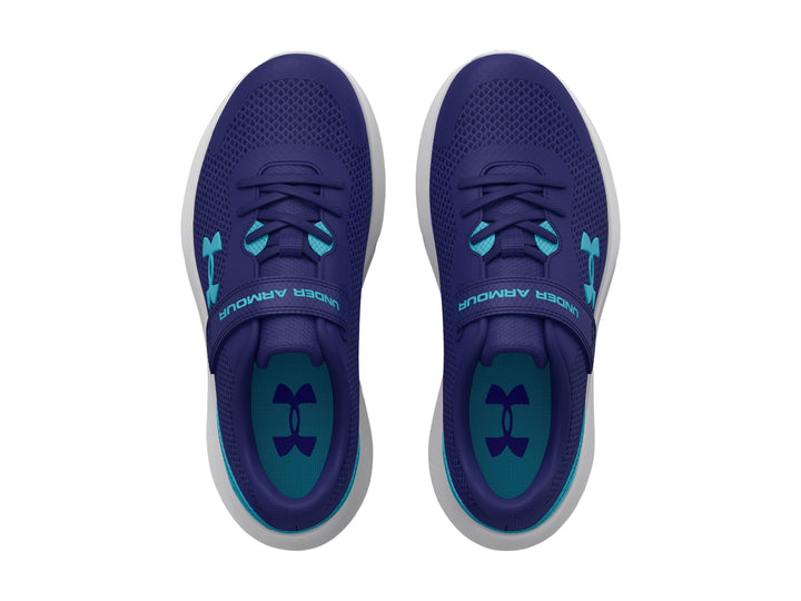 Tenis deportivos Under Armour color azul con detalles en turquesa, suela blanca y cierre de correa con velcro.