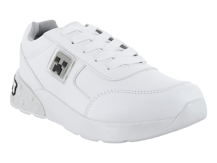 Tenis deportivos color blanco para niño o niña con detalles en gris y agujetas blancas.