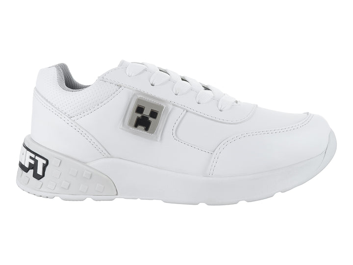 Tenis deportivos color blanco para niño o niña con detalles en gris y agujetas blancas.