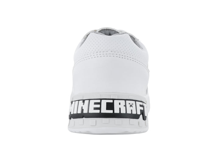 Tenis deportivos color blanco para niño o niña con detalles en gris y agujetas blancas.