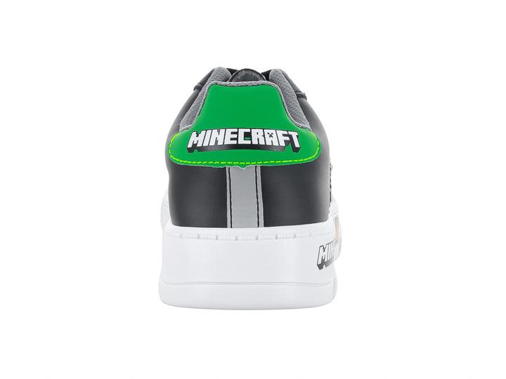 Tenis infantiles color negro y gris con detalles temáticos de Minecraft y suela blanca.