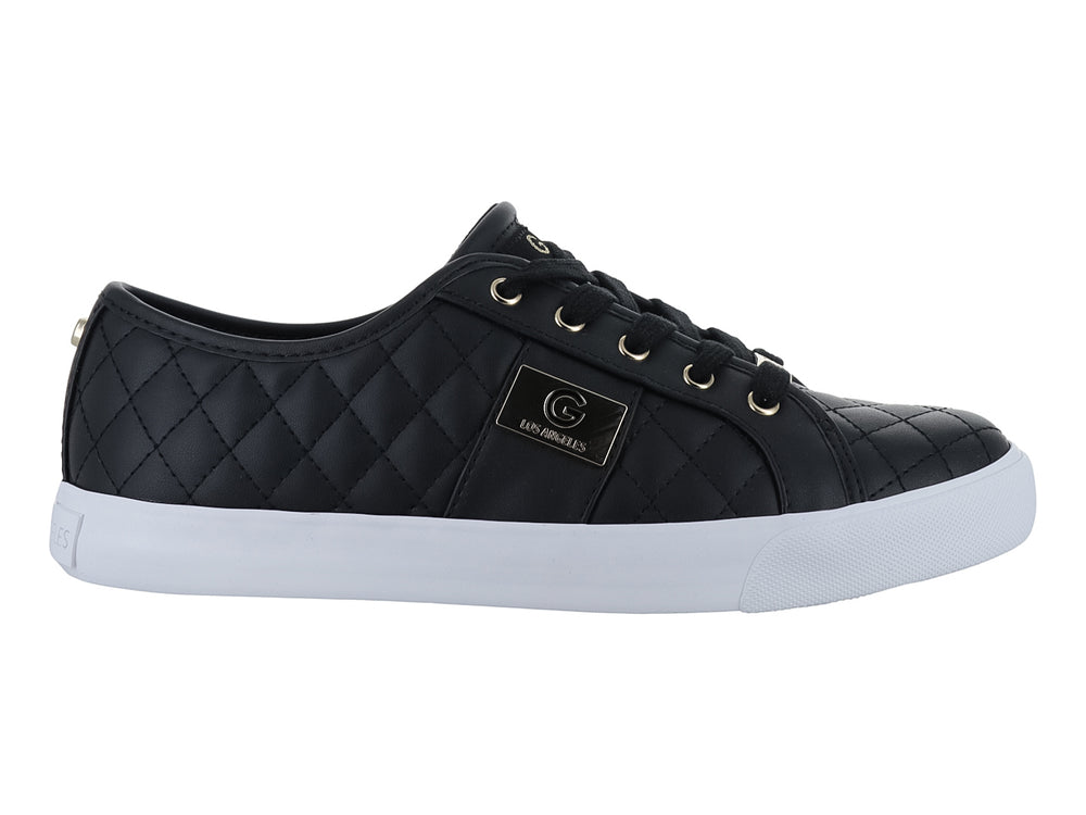 Tenis casuales negros para mujer con suela blanca y detalles dorados.