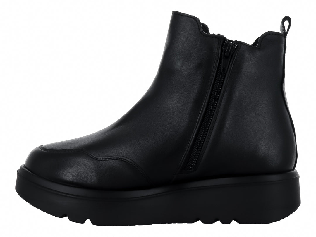 Botas negras de piel para mujer con suela gruesa tipo plataforma y panel elástico lateral.