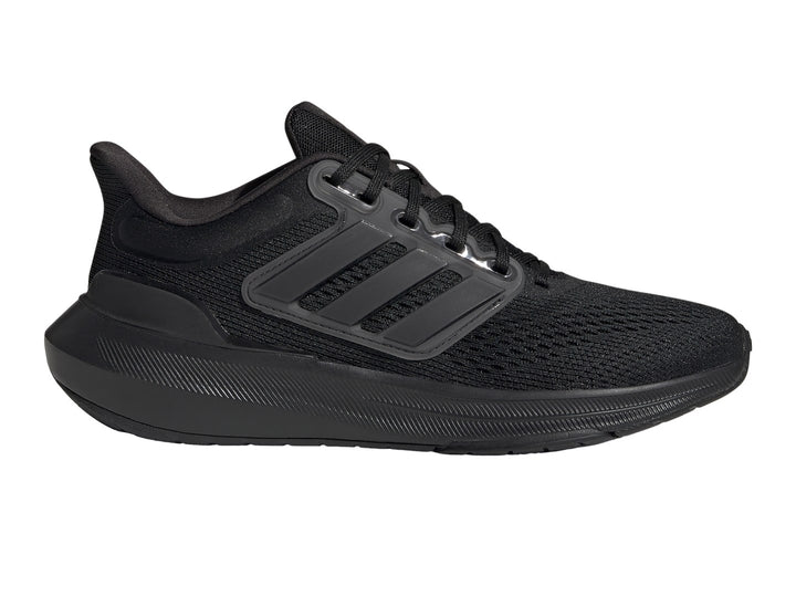 Tenis deportivos Adidas Ultrabounce en color negro total con tejido de malla y suela gruesa.