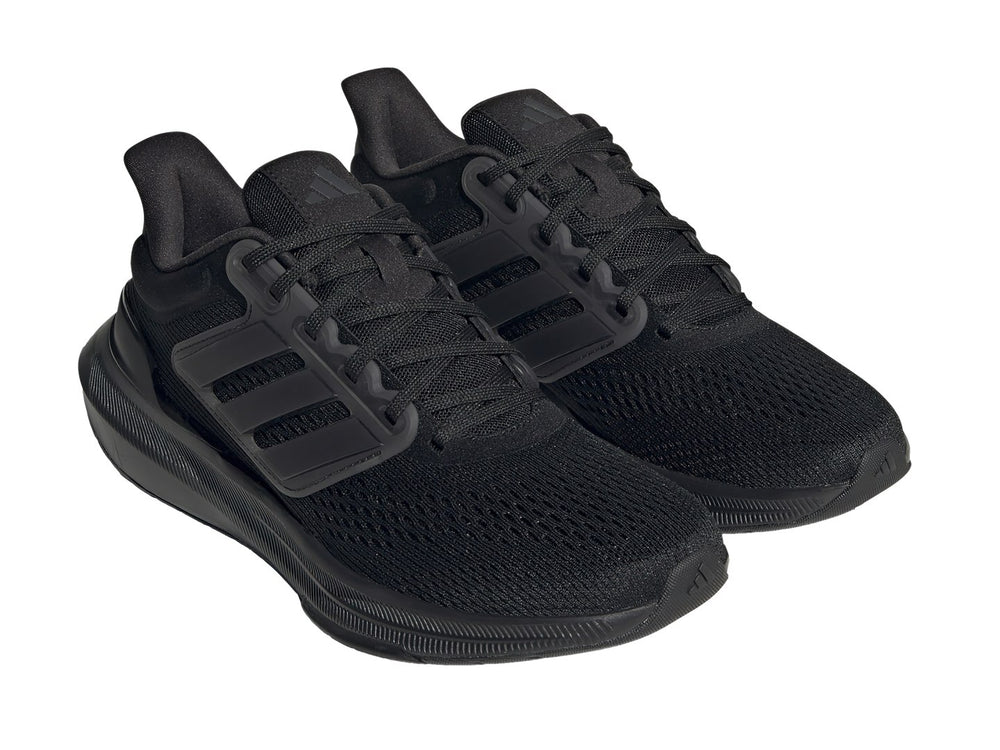 Tenis deportivos Adidas Ultrabounce en color negro total con tejido de malla y suela gruesa.