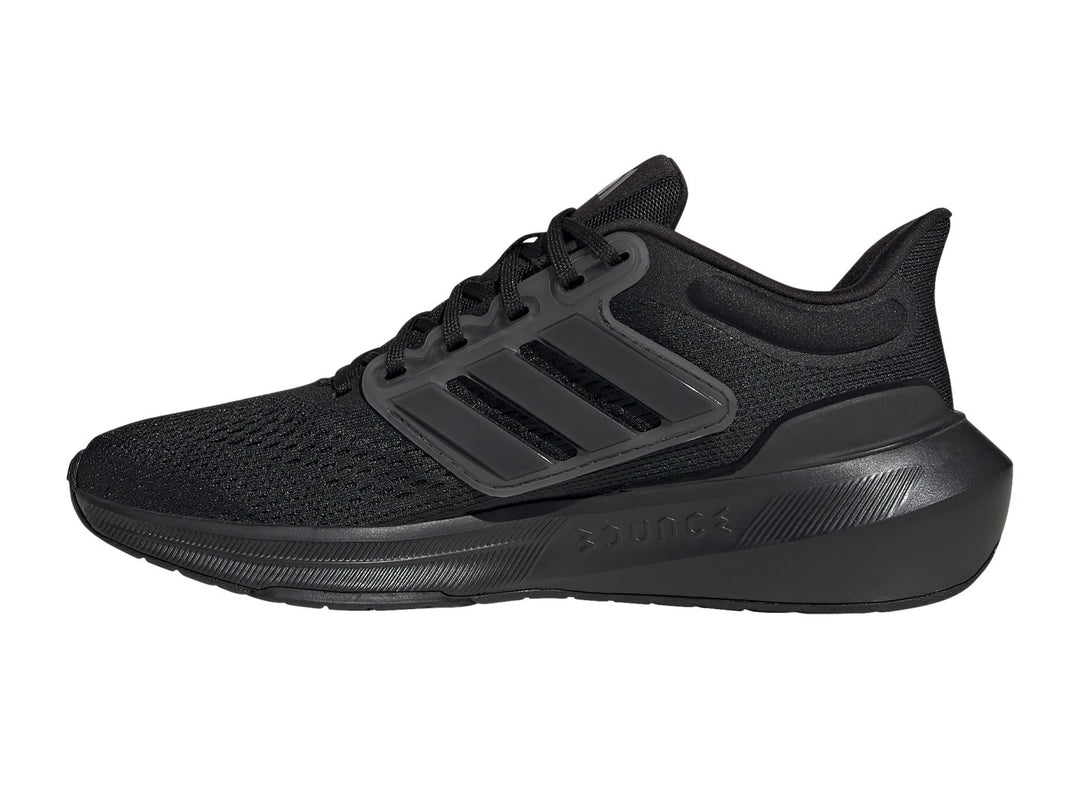 Tenis deportivos Adidas Ultrabounce en color negro total con tejido de malla y suela gruesa.