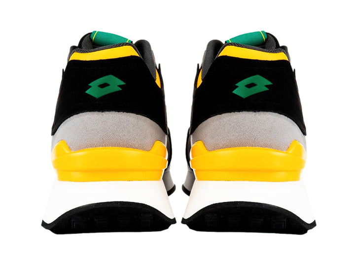 Tenis deportivos Lotto en colores gris, negro y amarillo con suela blanca y detalles verdes.