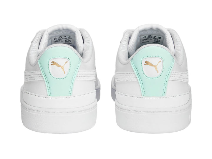 Tenis Puma blancos con detalle en verde menta en el talón, estilo deportivo y casual.