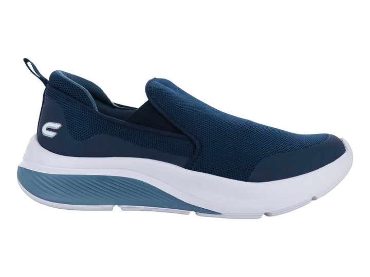 Tenis deportivos slip-on color azul marino con suela blanca y gris.