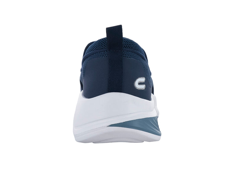 Tenis deportivos slip-on color azul marino con suela blanca y gris.