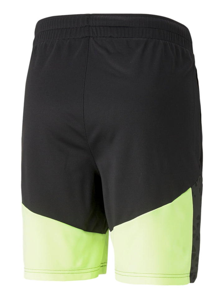 Shorts deportivos PUMA en colores negro y amarillo neón con cintura elástica.