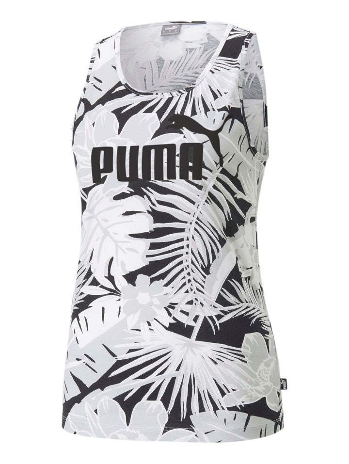 Mujer vistiendo camiseta sin mangas PUMA blanca con estampado de hojas negras y logotipo frontal.