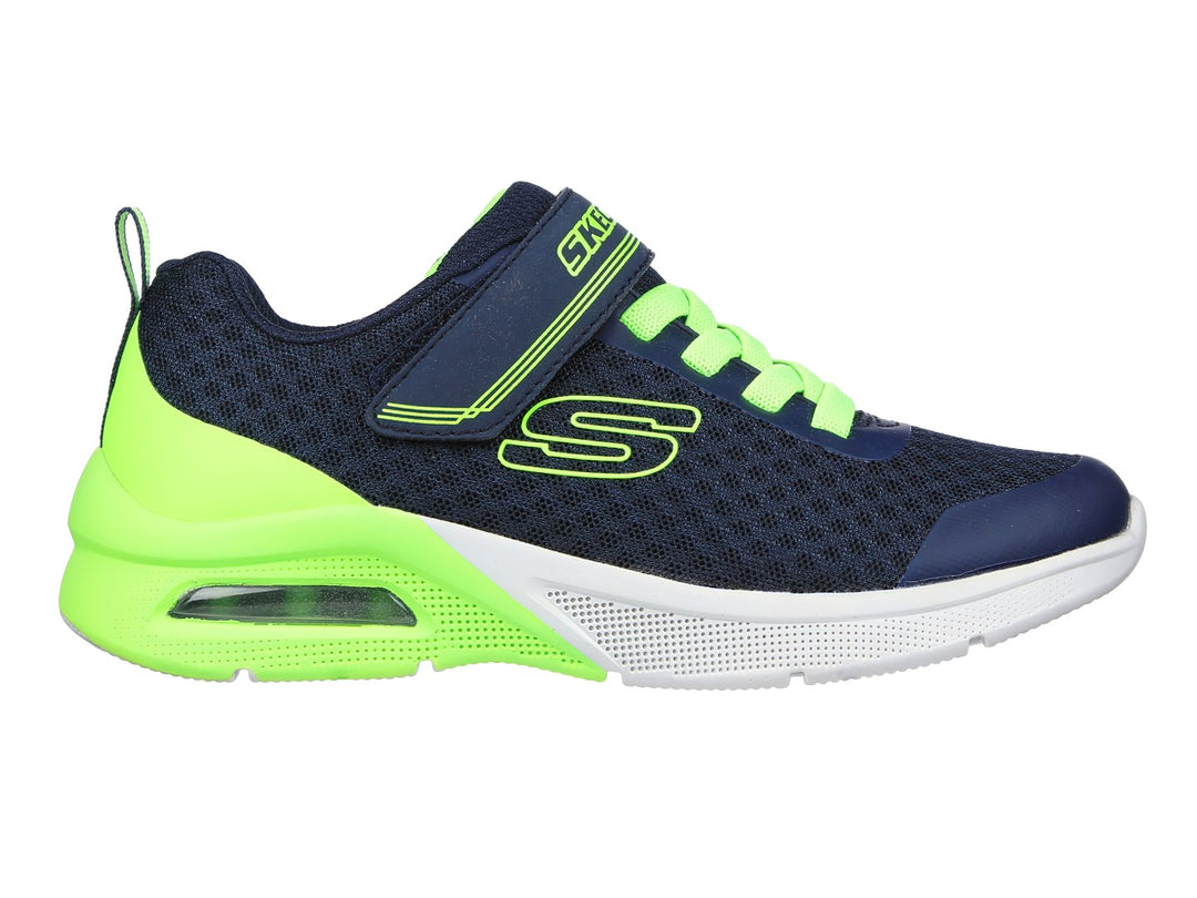 Tenis deportivos Skechers para niño en color azul marino y verde lima con cierre de velcro y agujetas.