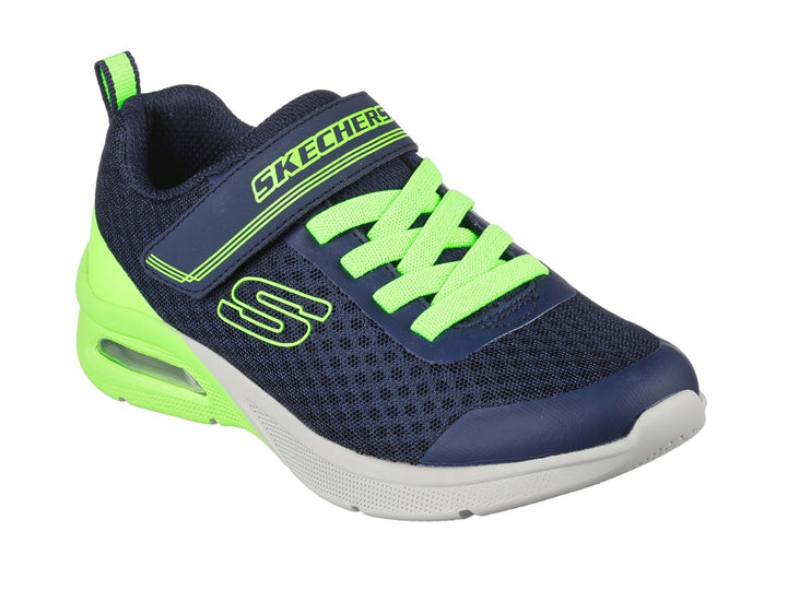 Tenis deportivos Skechers para niño en color azul marino y verde lima con cierre de velcro.