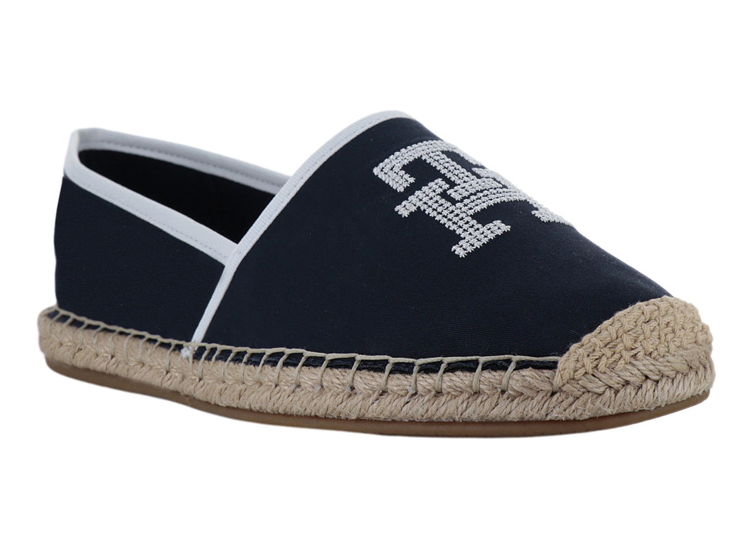 Zapato alpargata azul marino con suela de yute y detalles en blanco.