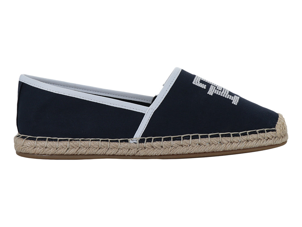 Zapato alpargata azul marino con suela de yute y detalles en blanco.