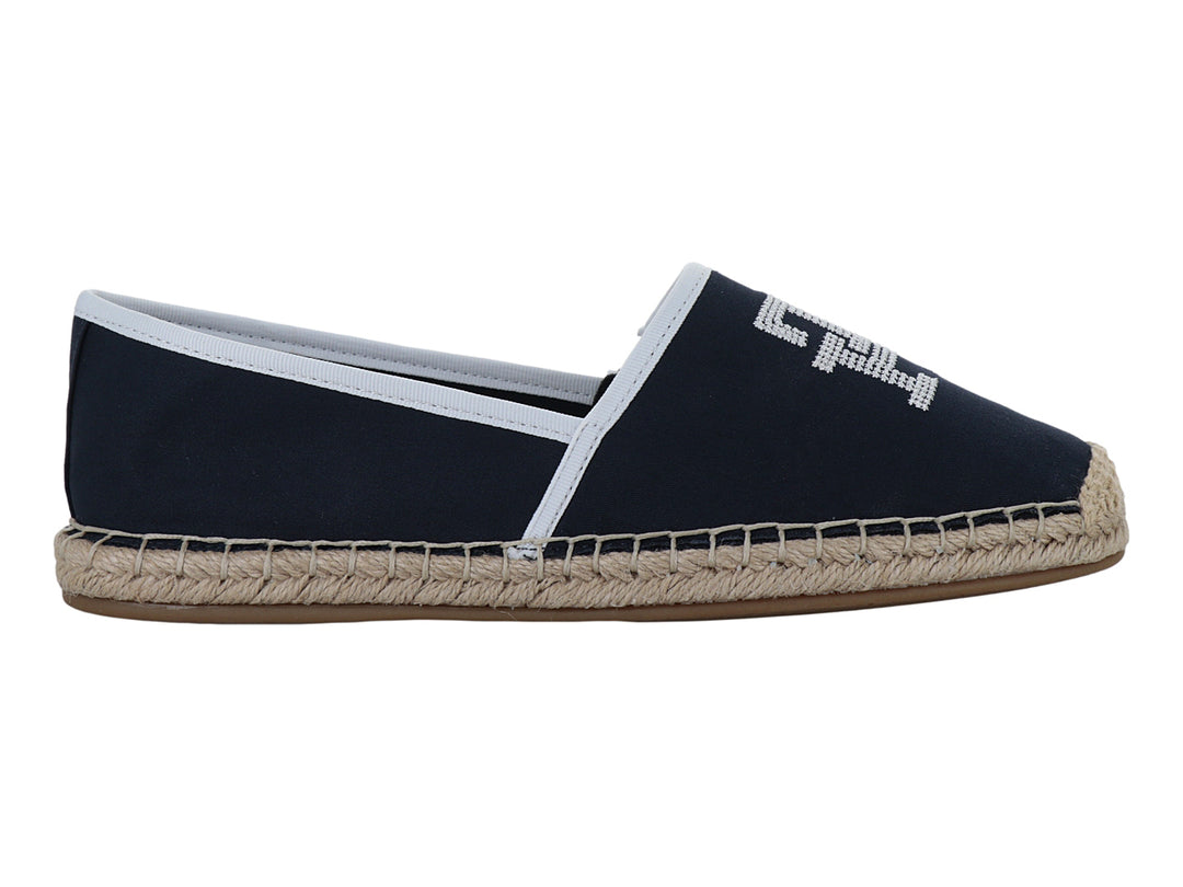 Zapato alpargata azul marino con suela de yute y detalles en blanco.