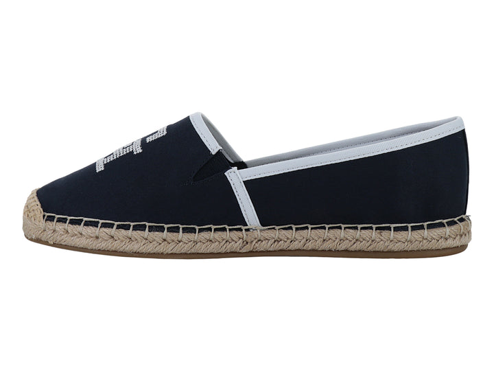 Zapato alpargata azul marino con suela de yute y detalles en blanco.