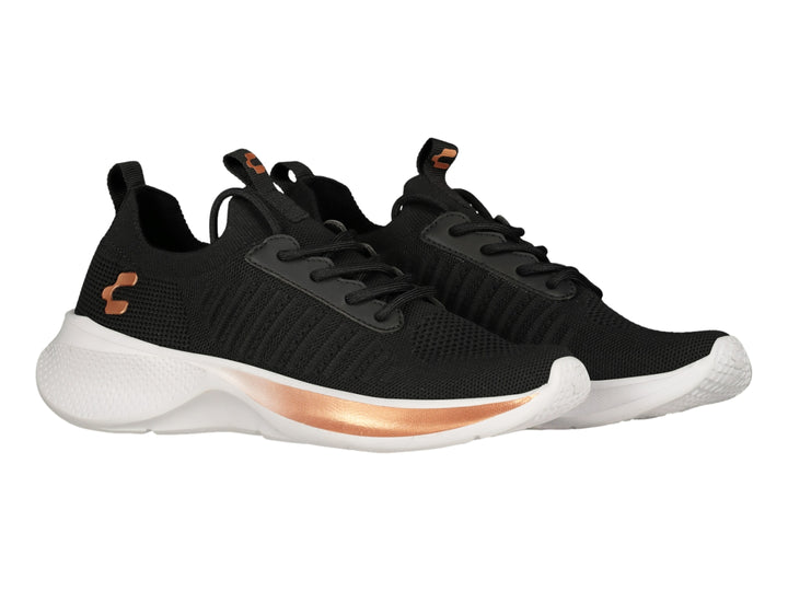Tenis deportivos Charly color negro con suela blanca y detalles en plata.