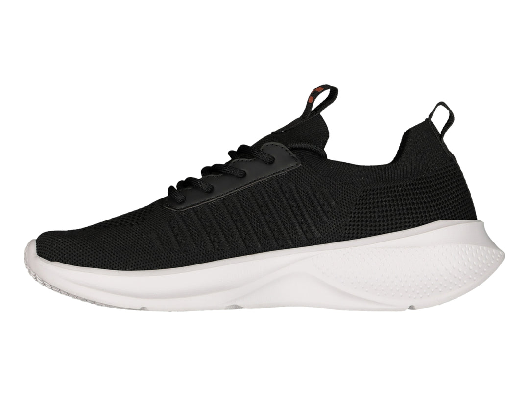 Tenis deportivos Charly color negro con suela blanca y detalles en plata.