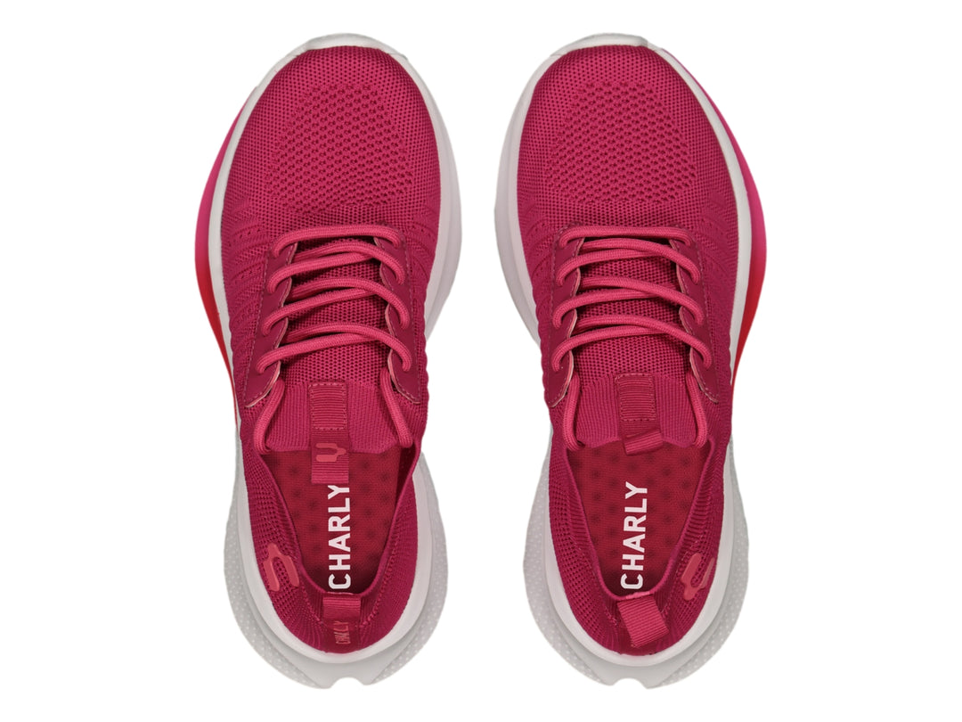 Tenis deportivos Charly en color rosa con suela blanca y detalles en degradado rosa.