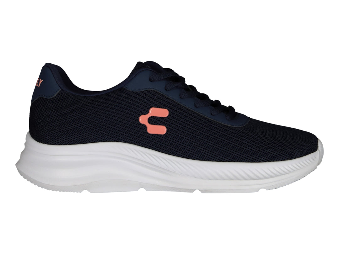 Tenis deportivos Charly en color azul marino con suela blanca y logo naranja lateral.