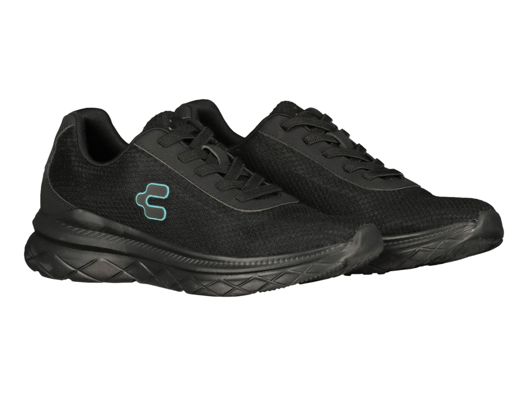 Tenis deportivos Charly color negro con suela gruesa y logo lateral en azul claro.