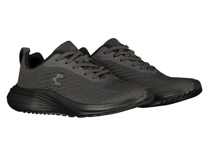 Par de tenis deportivos Charly en color gris oscuro con suela negra y agujetas coordinadas.