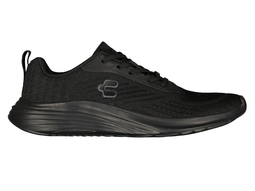 Par de tenis deportivos Charly en color negro con tejido de malla y suela negra.