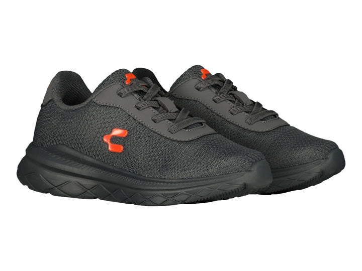 Tenis deportivos Charly color gris con suela negra y logotipo naranja.