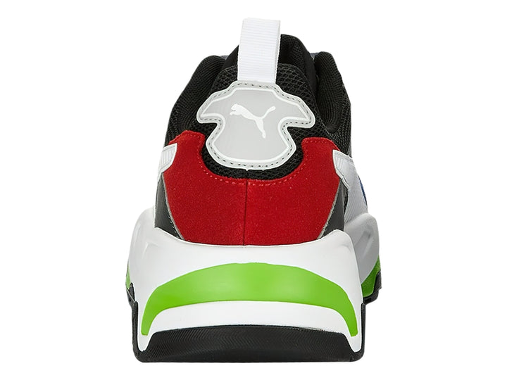 Tenis PUMA multicolor con suela blanca gruesa y detalles en rojo, azul y verde.