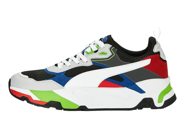 Tenis PUMA multicolor con suela blanca gruesa y detalles en rojo, azul y verde.