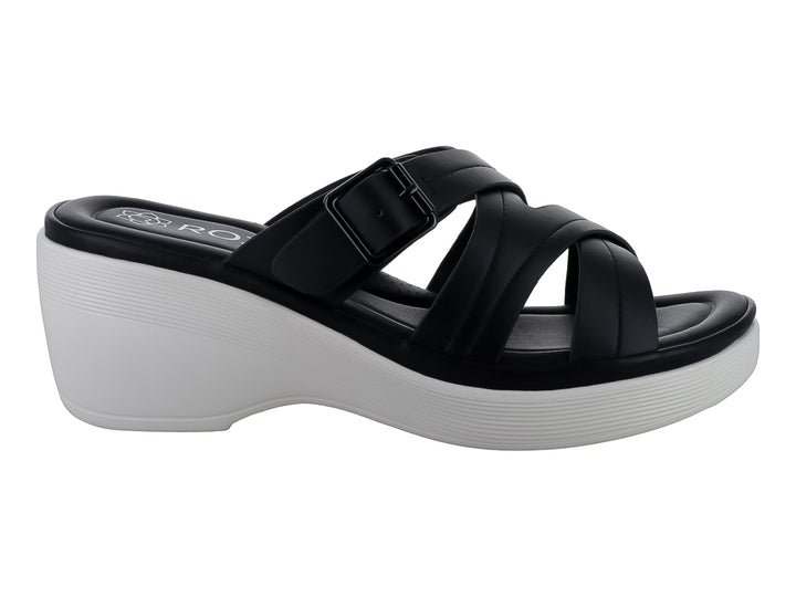 Sandalia de plataforma color negro con suela blanca y correas cruzadas con hebilla.