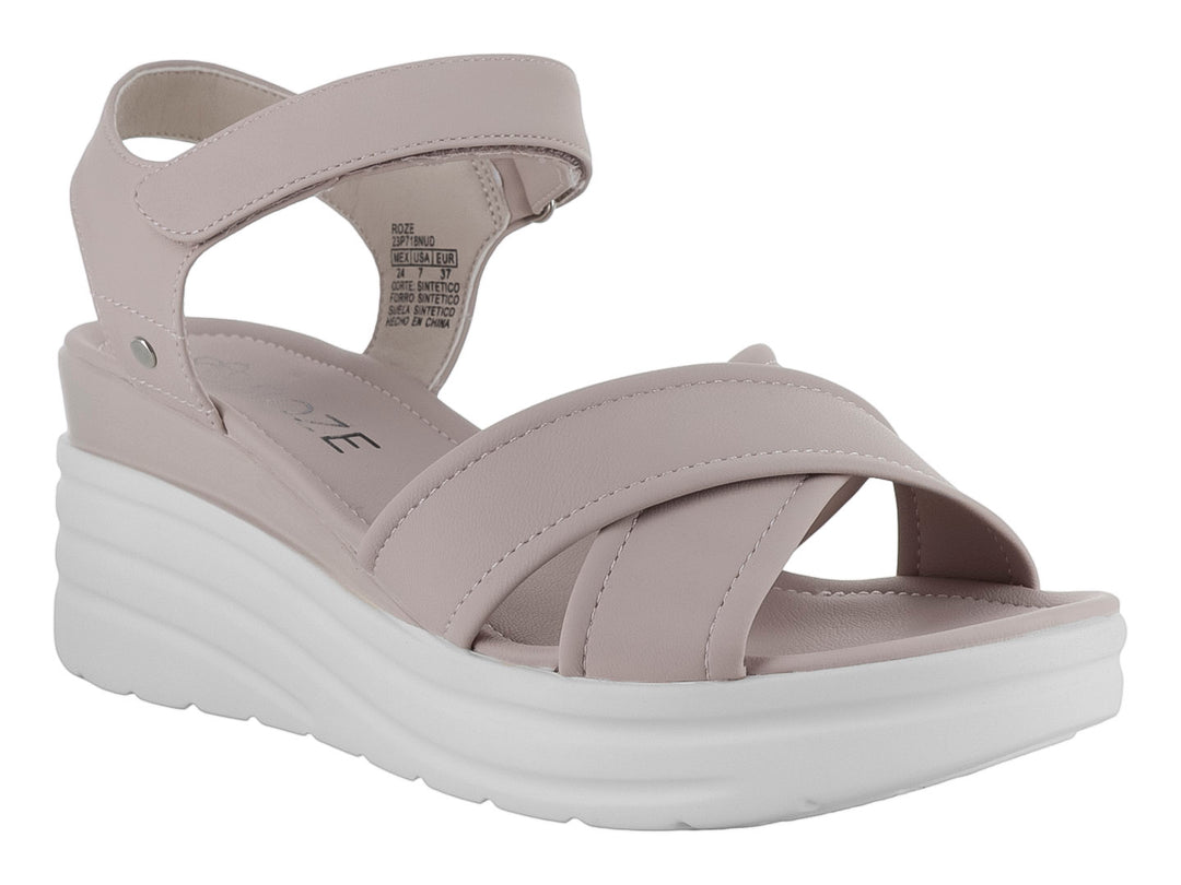 Sandalia de plataforma color beige con suela blanca y correa al tobillo para mujer.