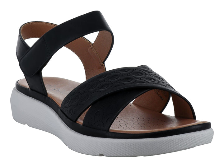 Sandalia casual para mujer color negro con suela blanca de plataforma y correa ajustable al tobillo.