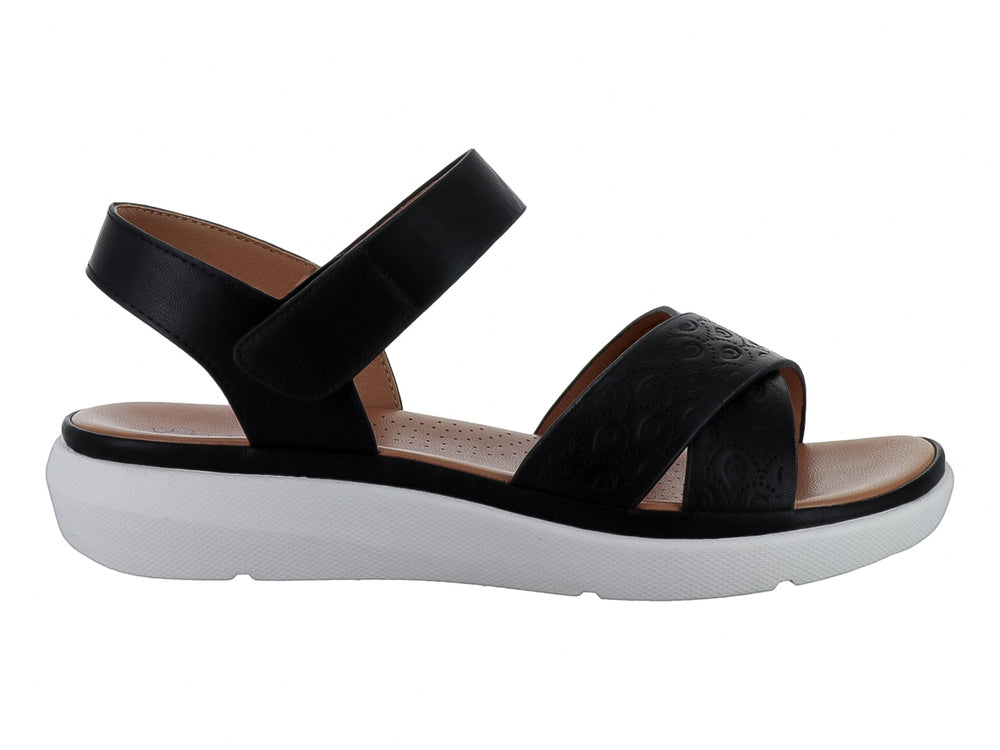 Sandalia casual para mujer color negro con suela blanca de plataforma y correa ajustable al tobillo.