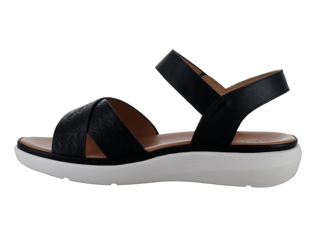 Sandalia casual para mujer color negro con suela blanca de plataforma y correa ajustable al tobillo.