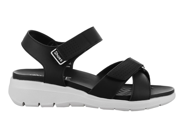Sandalia ROZE color negro con suela blanca, correas ajustables de velcro y diseño casual.