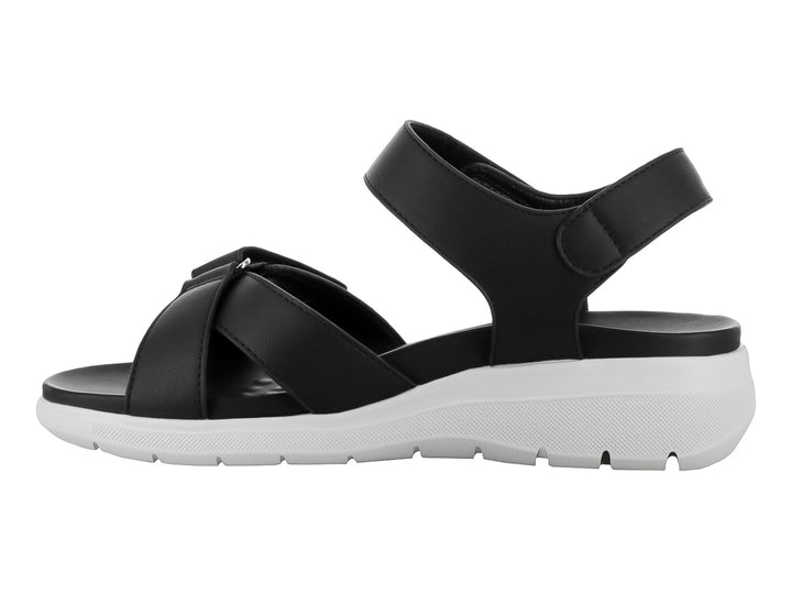 Sandalia ROZE color negro con suela blanca, correas ajustables de velcro y diseño casual.