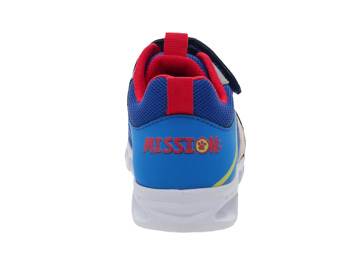 Tenis deportivos azules para niño con personajes de Paw Patrol, suela blanca y cierre de velcro.