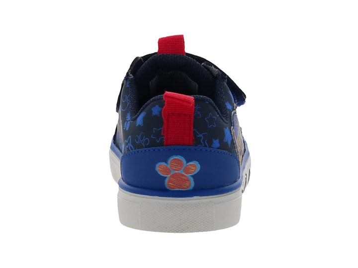 Tenis infantiles azul marino con personajes de Paw Patrol, suela blanca y cierre de velcro.