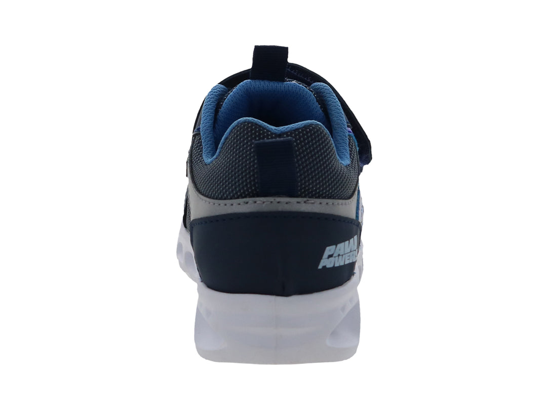 Tenis deportivos infantiles color azul marino con estampado de Paw Patrol y suela blanca.