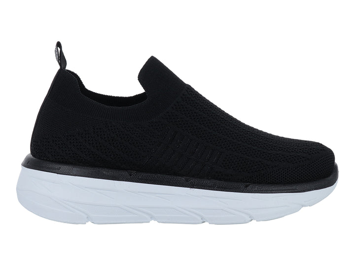 Tenis Furor negros de tela sin cordones con suela blanca gruesa y contours modernos.