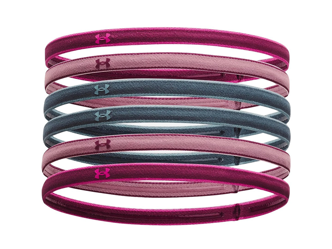 Set de 6 diademas deportivas Under Armour en colores morado, rosa y gris.