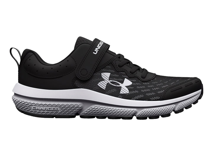 Tenis deportivos Under Armour color negro con suela blanca, cierre de correa y agujetas.