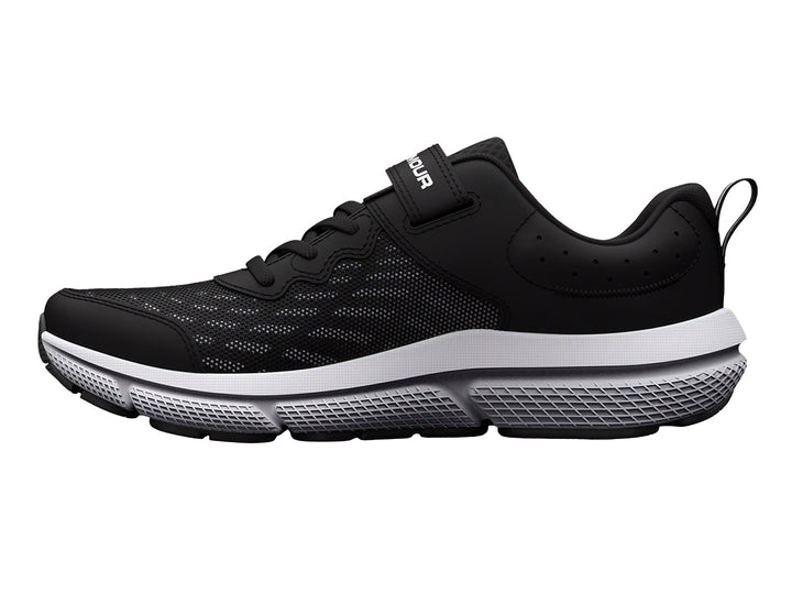Tenis deportivos Under Armour color negro con suela blanca, cierre de correa y agujetas.