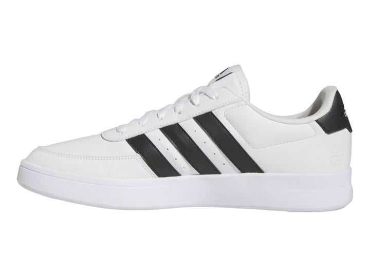 Tenis Adidas Breaknet 2.0 color blanco con tres franjas negras laterales y suela blanca.