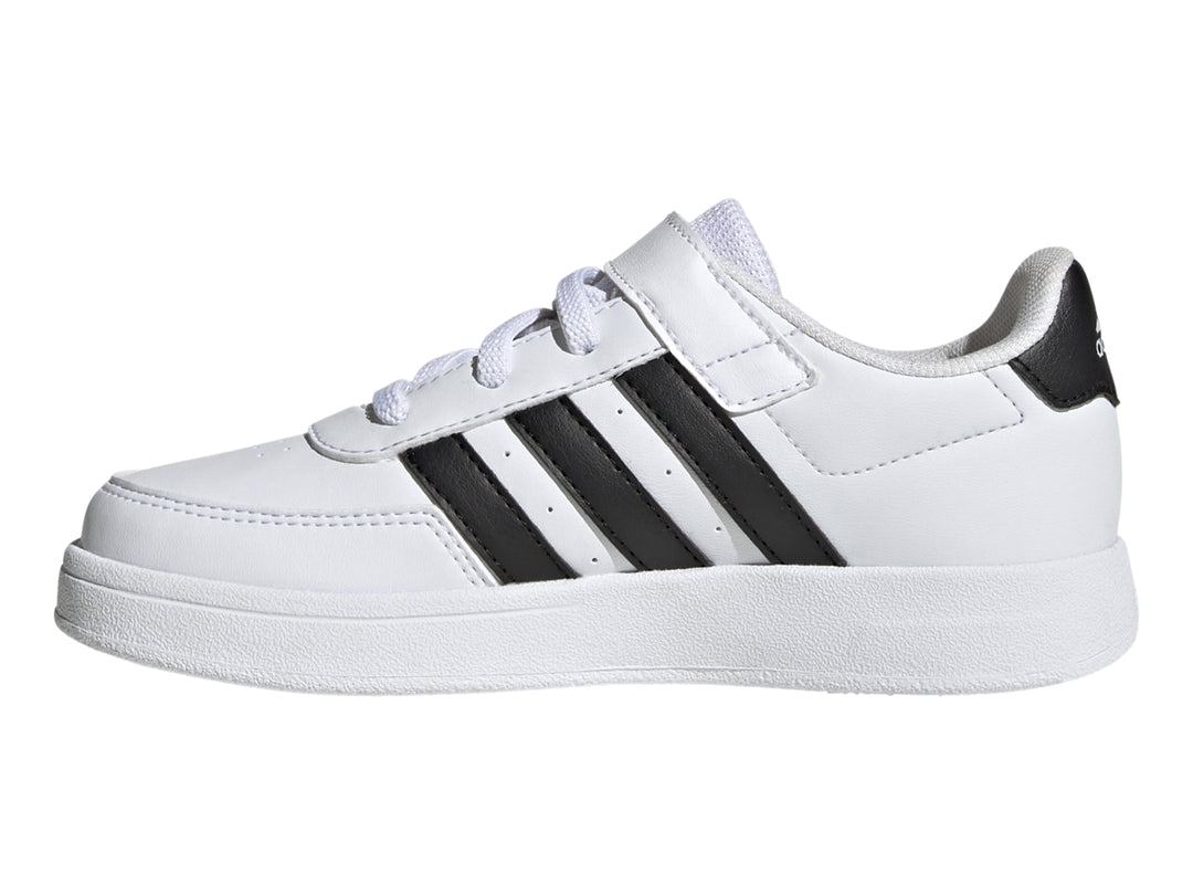 Tenis Adidas Breaknet 2.0 color blanco con tres franjas negras laterales, cierre de velcro y cordones para niño.
