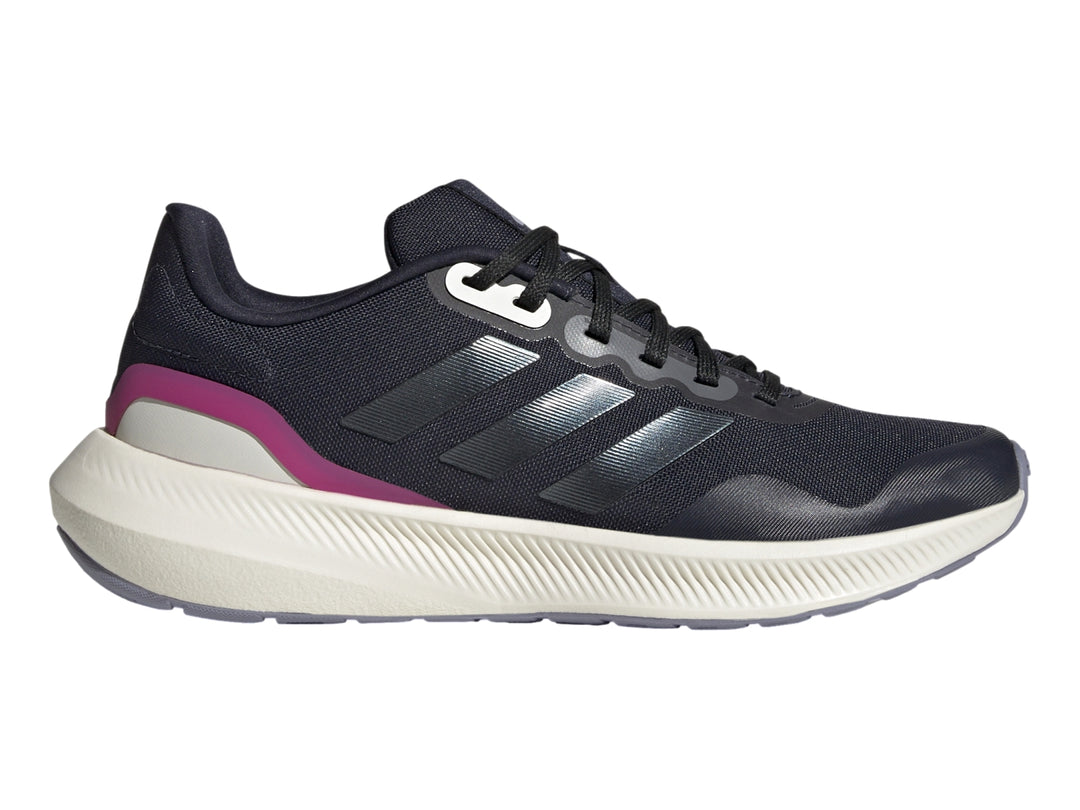 Tenis deportivos Adidas color azul marino con suela blanca y detalle fucsia en el talón.