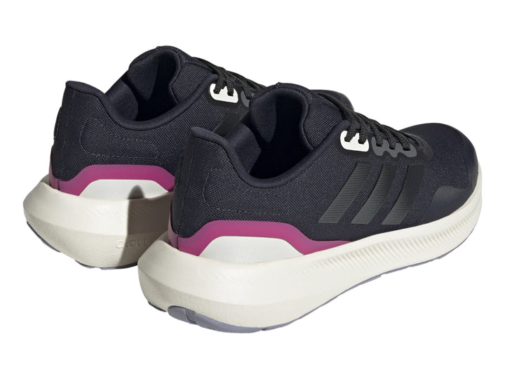 Tenis deportivos Adidas color azul marino con suela blanca y detalle fucsia en el talón.